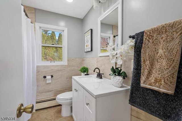 304 Lilac Ct, Bridgewater Twp, NJ 08807 - full bath featuring a baseboard heating unit, toilet, tile patterned floors, tile walls, and vanity