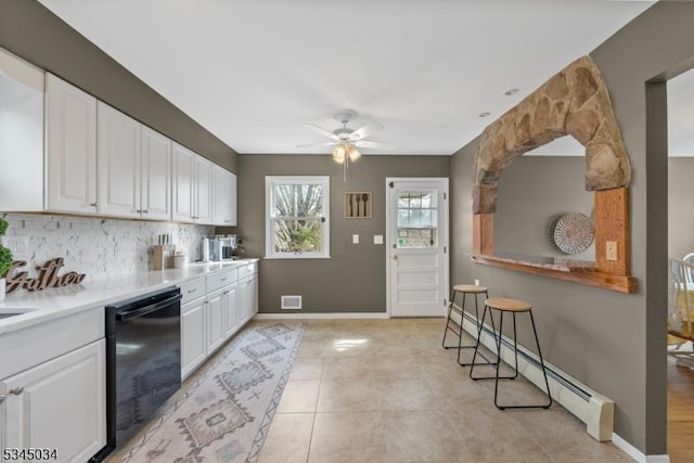 304 Lilac Ct, Bridgewater Twp, NJ 08807 - kitchen with dishwasher, white cabinets, a ceiling fan, decorative backsplash, and baseboard heating