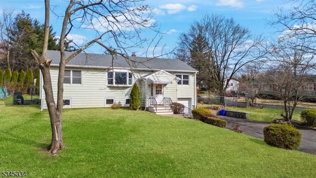 304 Lilac Ct, Bridgewater Twp, NJ 08807 - view of front of house featuring a garage, a front lawn, and asphalt driveway