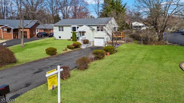 304 Lilac Ct, Bridgewater Twp, NJ 08807 - split foyer home featuring asphalt driveway, a front lawn, and an attached garage