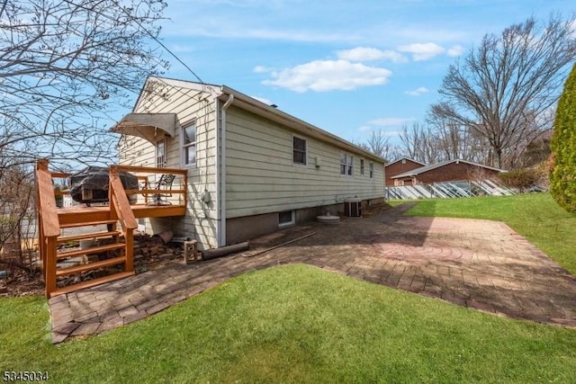 304 Lilac Ct, Bridgewater Twp, NJ 08807 - back of property featuring central air condition unit, a deck, a patio, a lawn, and stairway