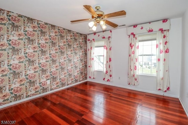 8 Staudt Ct, Franklin Twp, NJ 08873 - empty room featuring wood finished floors, plenty of natural light, ceiling fan, baseboards, and wallpapered walls
