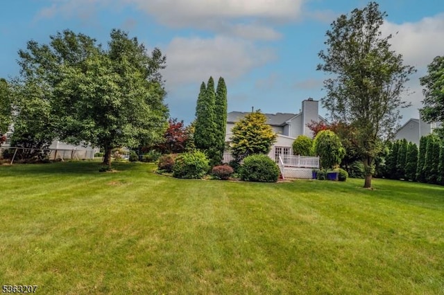 8 Staudt Ct, Franklin Twp, NJ 08873 - view of green lawn with a wooden deck