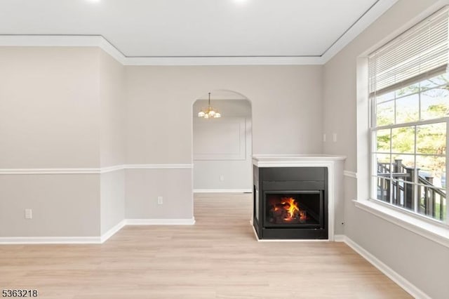 133 Marlboro Cir, Lopatcong Twp, NJ 08886 - unfurnished living room featuring light wood finished floors, a multi sided fireplace, a chandelier, crown molding, and baseboards