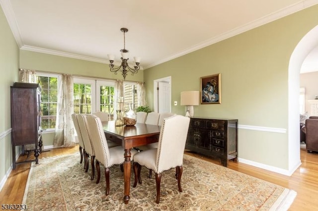 21 Stafford Ln, Bedminster Twp, NJ 07921 - dining room with arched walkways, a chandelier, wood finished floors, crown molding, and baseboards