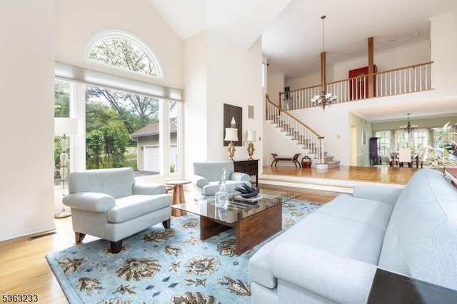 21 Stafford Ln, Bedminster Twp, NJ 07921 - living area with a high ceiling, a chandelier, wood finished floors, and stairway