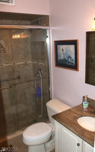 75 Sunrise Ter, Cedar Grove Twp, NJ 07009 - full bath featuring vanity, toilet, and a shower stall
