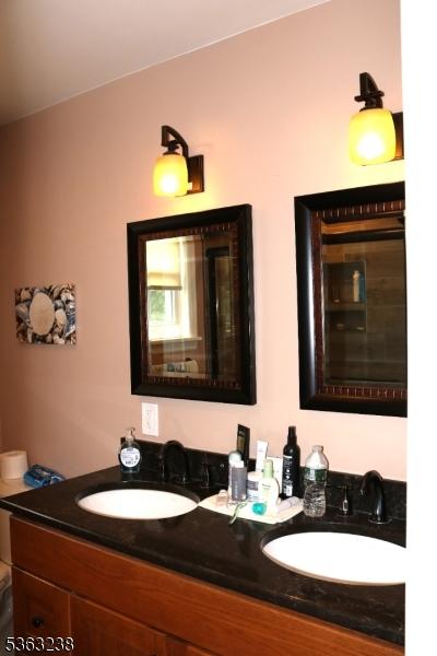 75 Sunrise Ter, Cedar Grove Twp, NJ 07009 - bathroom with double vanity and toilet