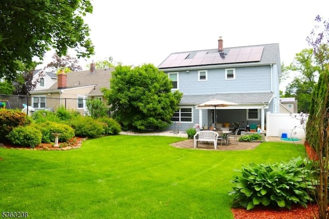 75 Sunrise Ter, Cedar Grove Twp, NJ 07009 - back of property with solar panels and a patio