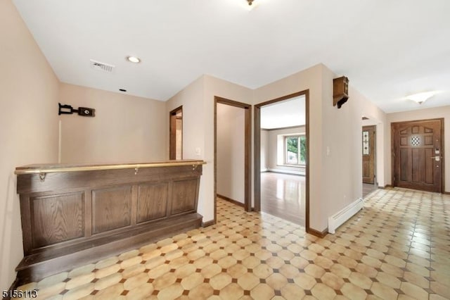 23 Bohnert Pl, Waldwick Boro, NJ 07463 - kitchen featuring baseboards, light flooring, and a baseboard radiator