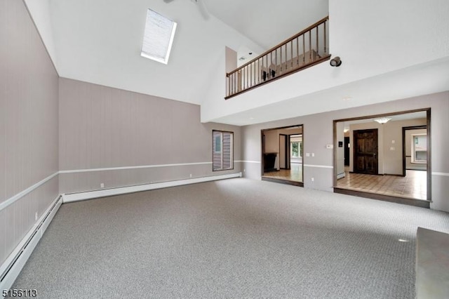23 Bohnert Pl, Waldwick Boro, NJ 07463 - unfurnished living room featuring a baseboard heating unit, carpet flooring, and high vaulted ceiling