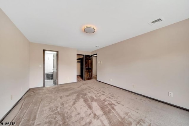 23 Bohnert Pl, Waldwick Boro, NJ 07463 - unfurnished bedroom featuring carpet, baseboards, and a walk in closet