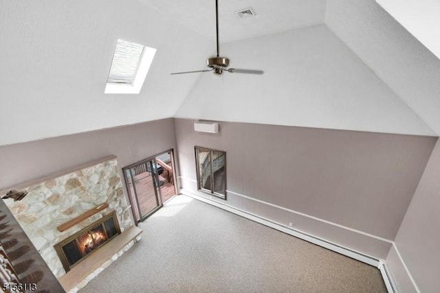 23 Bohnert Pl, Waldwick Boro, NJ 07463 - unfurnished living room featuring vaulted ceiling, a wall mounted air conditioner, a stone fireplace, carpet, and a skylight