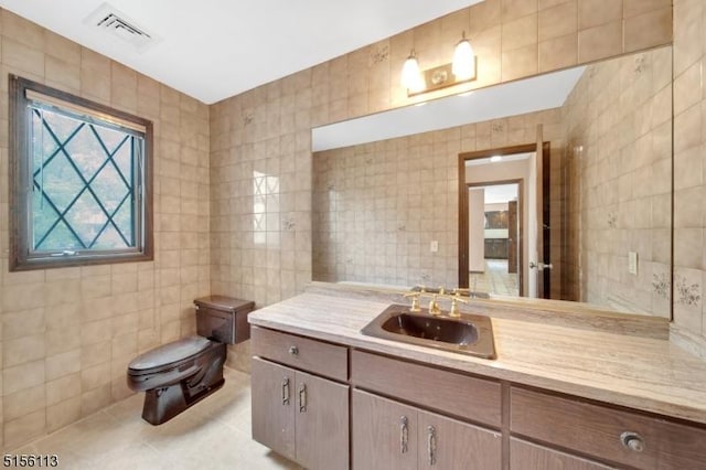 23 Bohnert Pl, Waldwick Boro, NJ 07463 - bathroom featuring tile walls, toilet, vanity, and tile patterned floors
