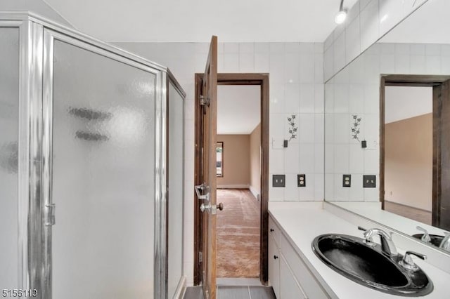 23 Bohnert Pl, Waldwick Boro, NJ 07463 - bathroom featuring a stall shower, vanity, and tile walls