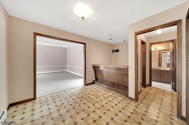 23 Bohnert Pl, Waldwick Boro, NJ 07463 - empty room featuring light flooring, a baseboard heating unit, and baseboards