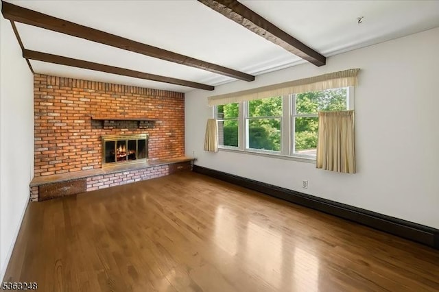 45 Churchill Rd, Cresskill Boro, NJ 07626 - unfurnished living room with wood finished floors, beamed ceiling, a brick fireplace, and baseboard heating