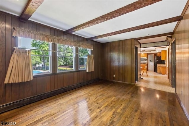 45 Churchill Rd, Cresskill Boro, NJ 07626 - spare room featuring beam ceiling, wood finished floors, and wooden walls