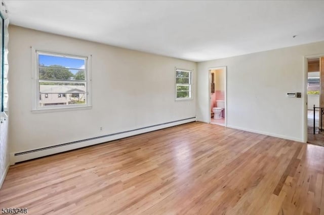 45 Churchill Rd, Cresskill Boro, NJ 07626 - spare room with a baseboard heating unit and wood finished floors