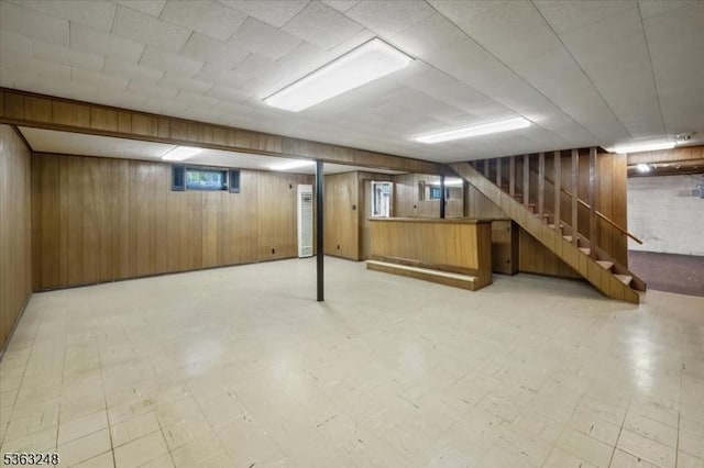 45 Churchill Rd, Cresskill Boro, NJ 07626 - basement with light flooring, wooden walls, and stairway