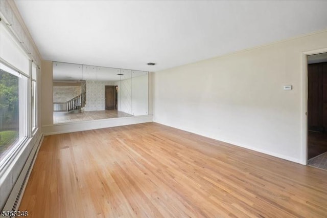 45 Churchill Rd, Cresskill Boro, NJ 07626 - unfurnished room featuring a baseboard heating unit and wood finished floors