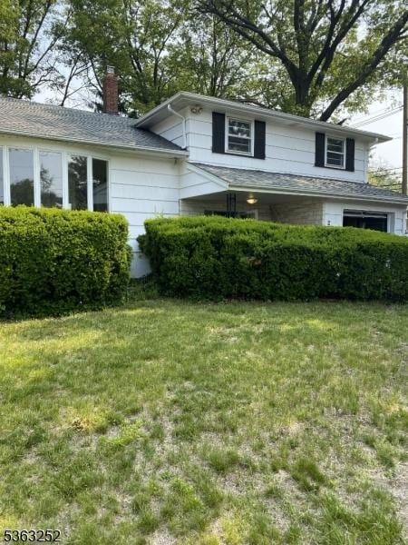 2 Perry Rd, Bloomfield Twp, NJ 07003 - split level home featuring a chimney and a front lawn