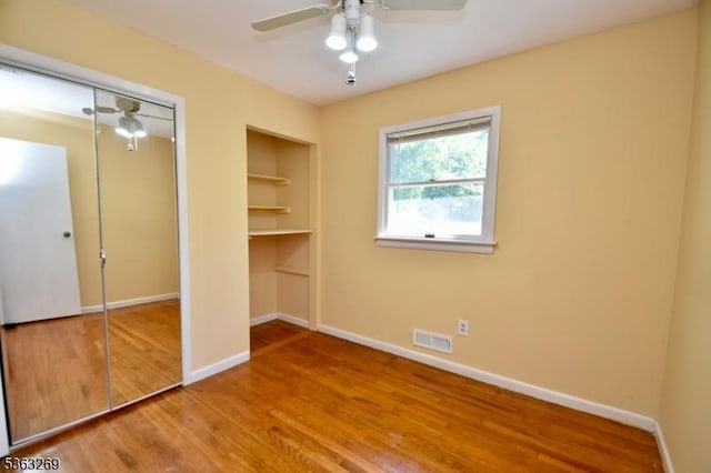18 Apollo Dr, Jefferson Twp, NJ 07438 - unfurnished bedroom featuring wood finished floors, a ceiling fan, and a closet