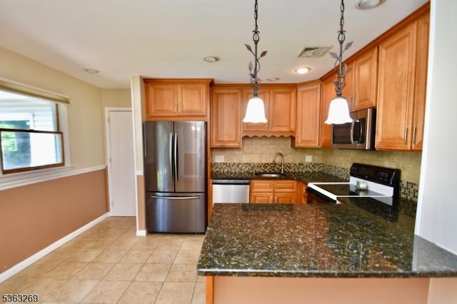 18 Apollo Dr, Jefferson Twp, NJ 07438 - kitchen with appliances with stainless steel finishes, tasteful backsplash, a peninsula, pendant lighting, and light tile patterned floors
