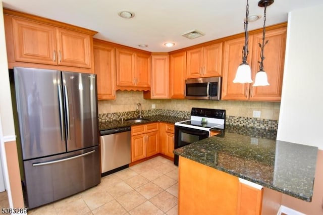 18 Apollo Dr, Jefferson Twp, NJ 07438 - kitchen featuring stainless steel appliances, tasteful backsplash, hanging light fixtures, and a peninsula