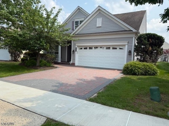 515 Crossfields Ln, Franklin Twp, NJ 08873 - view of front of property with decorative driveway, a garage, and a front lawn