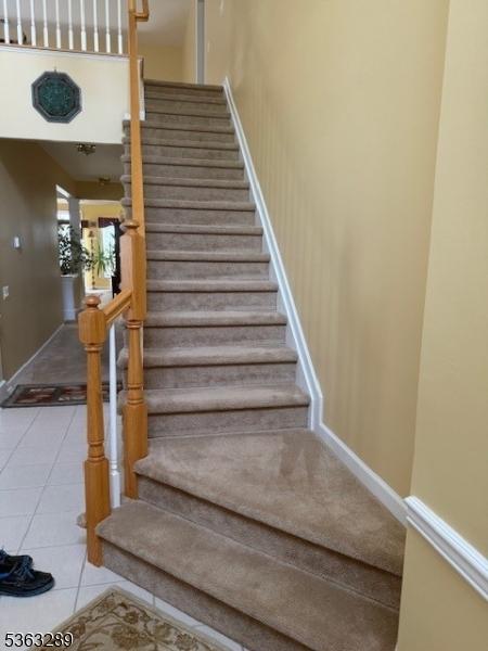 515 Crossfields Ln, Franklin Twp, NJ 08873 - stairs with tile patterned floors