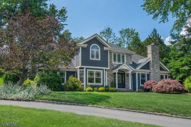 14 Mount Freedom Ave, Randolph Twp, NJ 07869 - view of front of house featuring stone siding, a front lawn, and a chimney