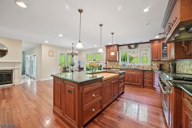 14 Mount Freedom Ave, Randolph Twp, NJ 07869 - kitchen featuring range with two ovens, brown cabinets, wood finished floors, plenty of natural light, and recessed lighting