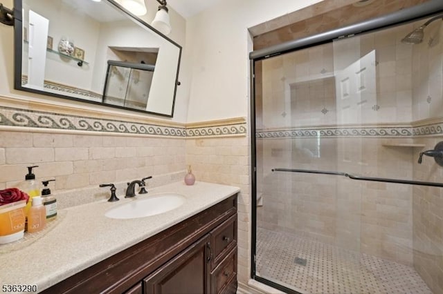 14 Mount Freedom Ave, Randolph Twp, NJ 07869 - bathroom with vanity, a shower stall, a wainscoted wall, and tile walls