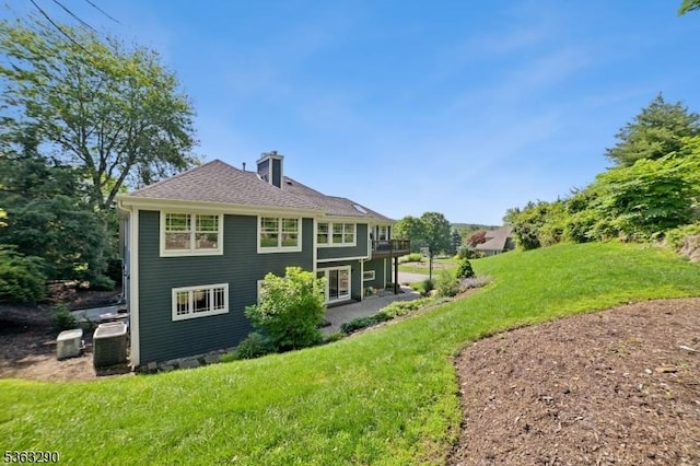 14 Mount Freedom Ave, Randolph Twp, NJ 07869 - back of property with a chimney, a lawn, and a wooden deck