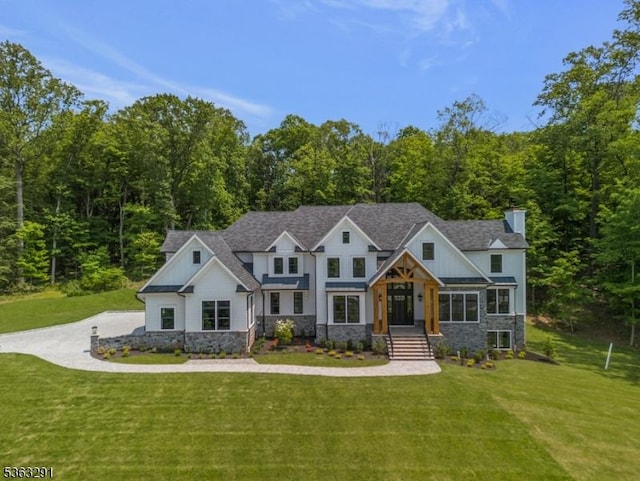 8 Cobblestone Ct, Warren Twp, NJ 07059 - view of front of house featuring stone siding, a chimney, a front lawn, and board and batten siding