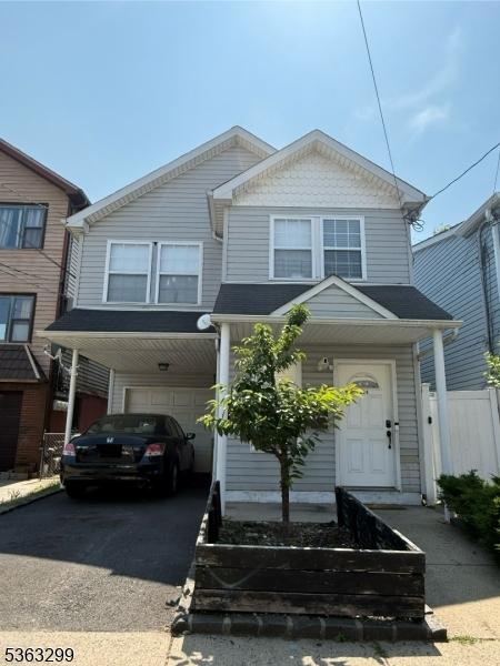 224 Pine St, Elizabeth City, NJ 07206 - view of front of home with a garage and driveway