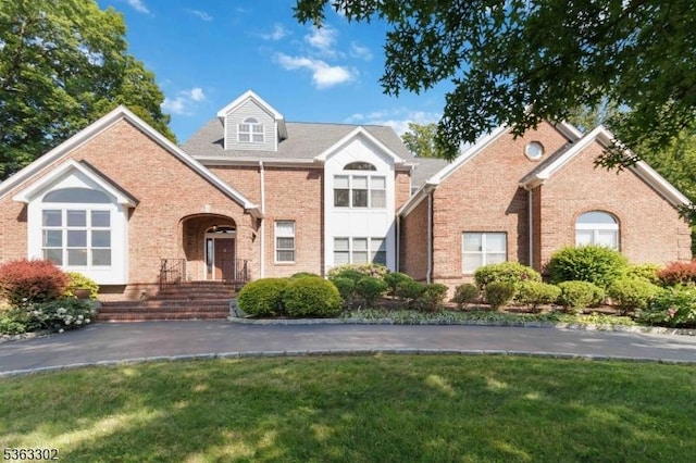 13 E Cove Ln, Morris Twp, NJ 07960 - traditional home with brick siding and a front yard