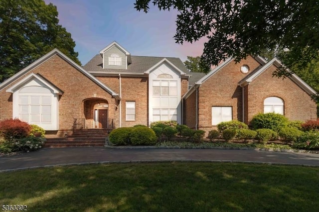 13 E Cove Ln, Morris Twp, NJ 07960 - traditional-style house featuring brick siding and a front lawn