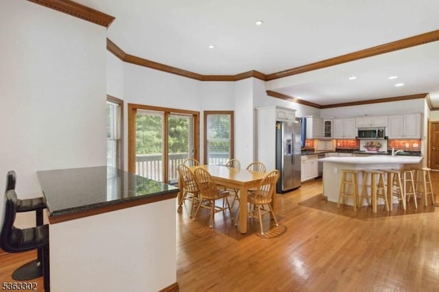 13 E Cove Ln, Morris Twp, NJ 07960 - dining room featuring crown molding, light wood-type flooring, and recessed lighting