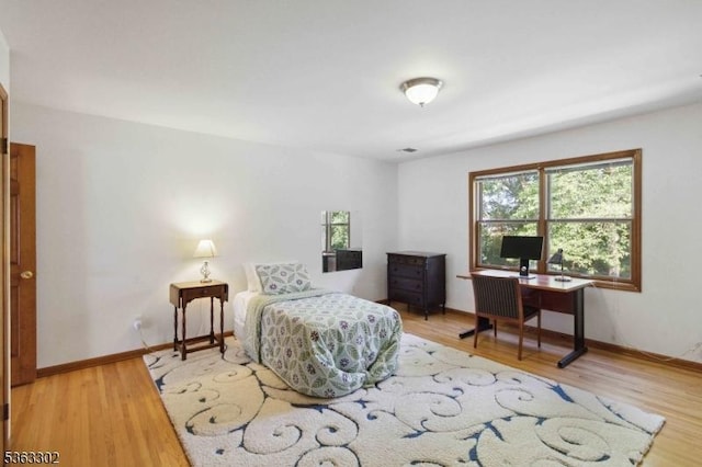 13 E Cove Ln, Morris Twp, NJ 07960 - bedroom featuring wood finished floors, baseboards, and a desk