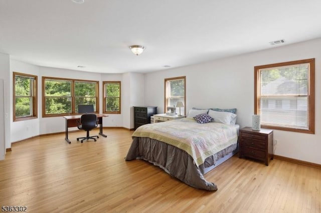 13 E Cove Ln, Morris Twp, NJ 07960 - bedroom with light wood-style floors, multiple windows, and baseboards