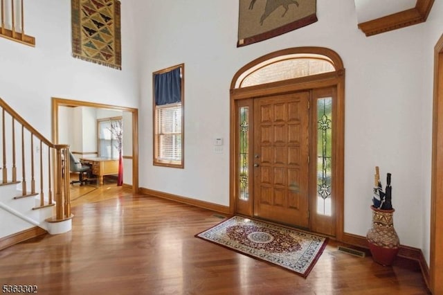 13 E Cove Ln, Morris Twp, NJ 07960 - entrance foyer featuring wood finished floors, stairway, baseboards, and a towering ceiling