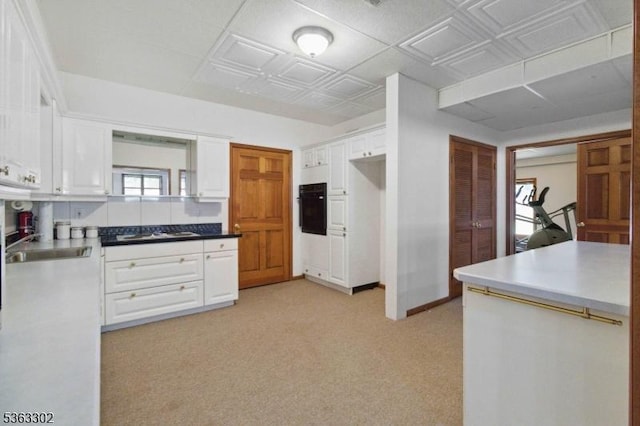 13 E Cove Ln, Morris Twp, NJ 07960 - kitchen featuring black oven, white cabinetry, a sink, and gas stovetop