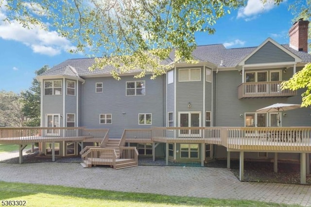 13 E Cove Ln, Morris Twp, NJ 07960 - back of property with a deck and a patio area