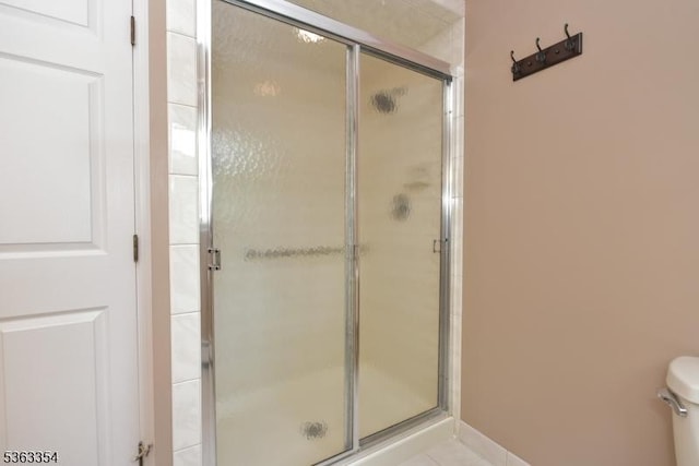 50 Van Schaik Ln, Wyckoff Twp, NJ 07481 - bathroom featuring a shower stall, toilet, and tile patterned floors