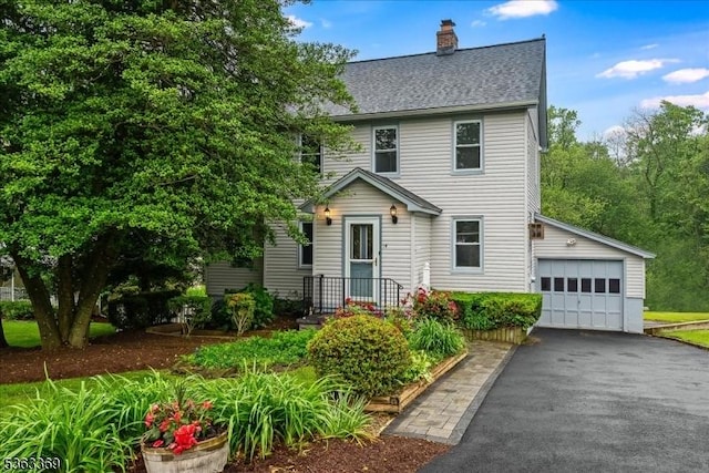 14 Prospect Pl, Morris Twp, NJ 07960 - view of front of house with a chimney, driveway, and a shingled roof