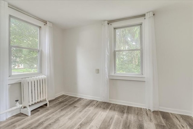 14 Prospect Pl, Morris Twp, NJ 07960 - empty room with radiator and wood finished floors