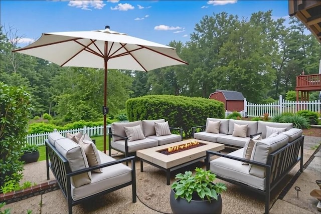 14 Prospect Pl, Morris Twp, NJ 07960 - fenced backyard featuring an outdoor living space with a fire pit, a storage shed, and a patio area