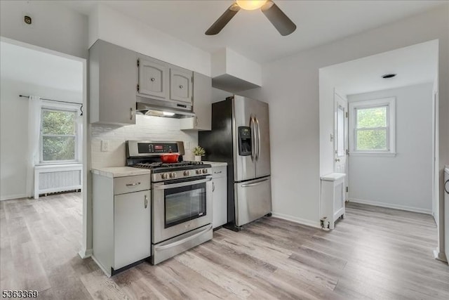 14 Prospect Pl, Morris Twp, NJ 07960 - kitchen with stainless steel appliances, under cabinet range hood, gray cabinets, and light wood-type flooring
